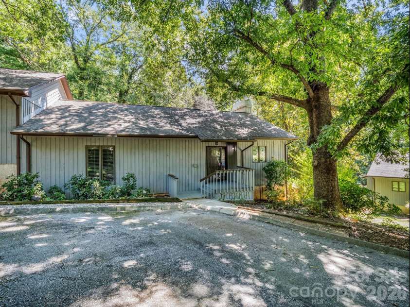 335 Melrose Avenue, Tryon, NC 28782.  MLS# CAR4417394, YatesRealty ID 9529. Mature trees