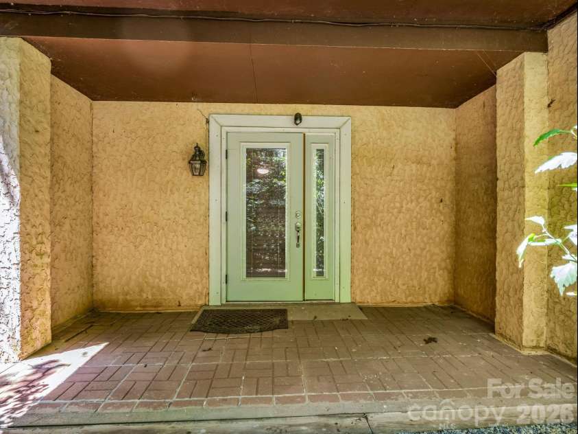 335 Melrose Avenue, Tryon, NC 28782.  MLS# CAR4417394, YatesRealty ID 9529. Pella door with sidelight in lower level