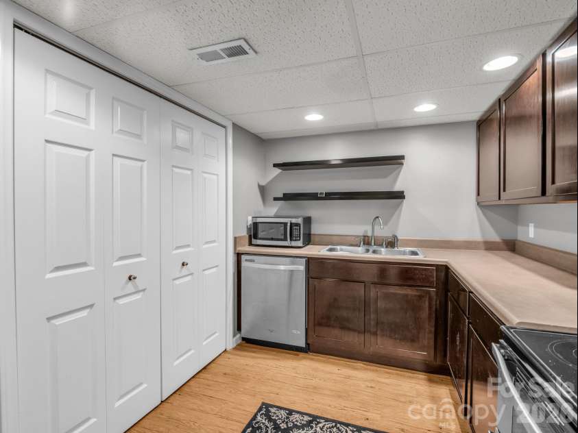 335 Melrose Avenue, Tryon, NC 28782.  MLS# CAR4417394, YatesRealty ID 9529. Recessed lighting and some open shelving