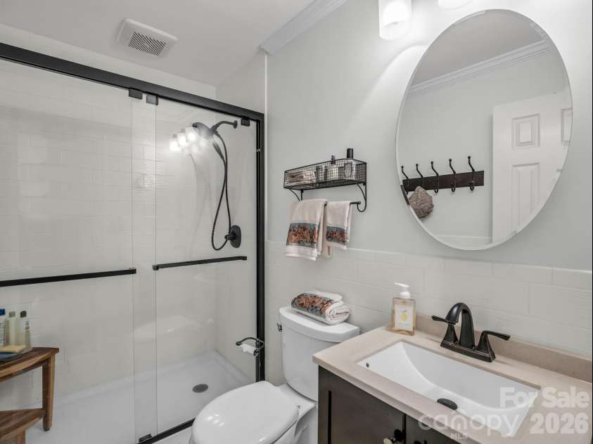 335 Melrose Avenue, Tryon, NC 28782.  MLS# CAR4417394, YatesRealty ID 9529. Updated Full Bath adjacent to Bedroom #2