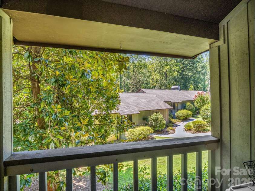 335 Melrose Avenue, Tryon, NC 28782.  MLS# CAR4417394, YatesRealty ID 9529. View off Balcony in Great room