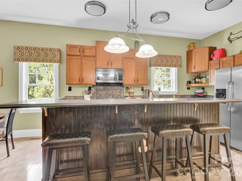 267 Ikerd Drive, Concord, NC 28025.  MLS# CAR4264417, YatesRealty ID 9533. Kitchen counter eating:)