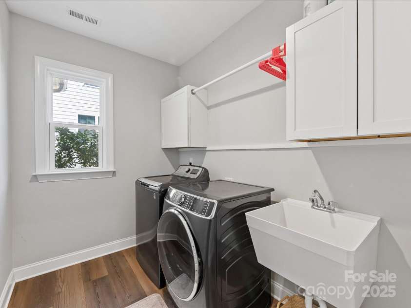 5013 Watercrest Trail, Belmont, NC 28012.  MLS# CAR4234154, YatesRealty ID 9534. Laundry with utility sink and cabinets