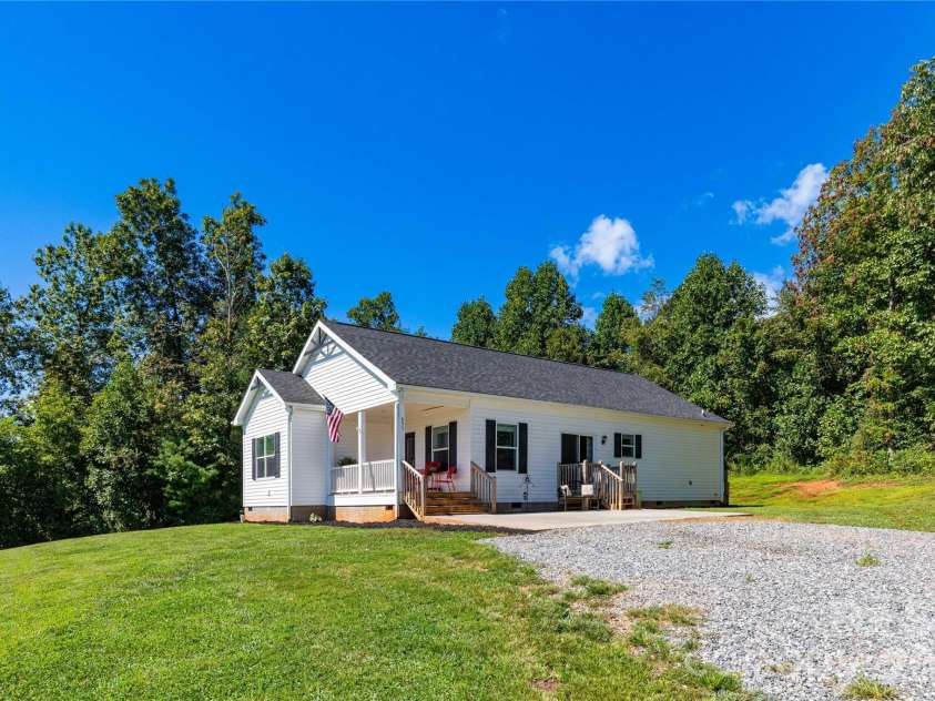653 Mag Sluder Road, Alexander, NC 28701.  MLS# CAR4299475, YatesRealty ID 9536. Exterior with large driveway