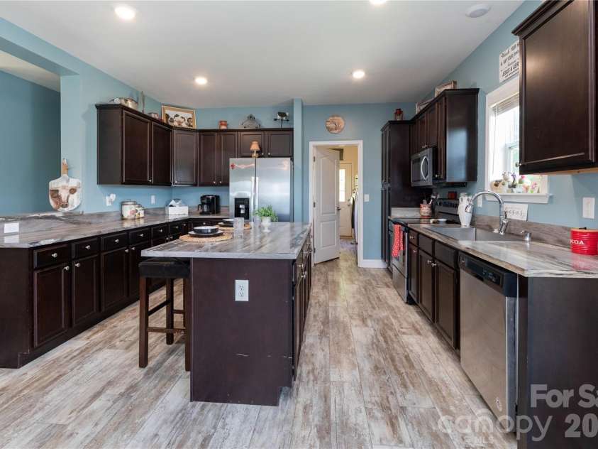 653 Mag Sluder Road, Alexander, NC 28701.  MLS# CAR4299475, YatesRealty ID 9536. Kitchen with large island 
