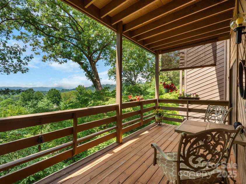 305 Piney Mountain Drive, Asheville, NC 28805.  MLS# CAR4286692, YatesRealty ID 9539. Covered deck with mountain views!