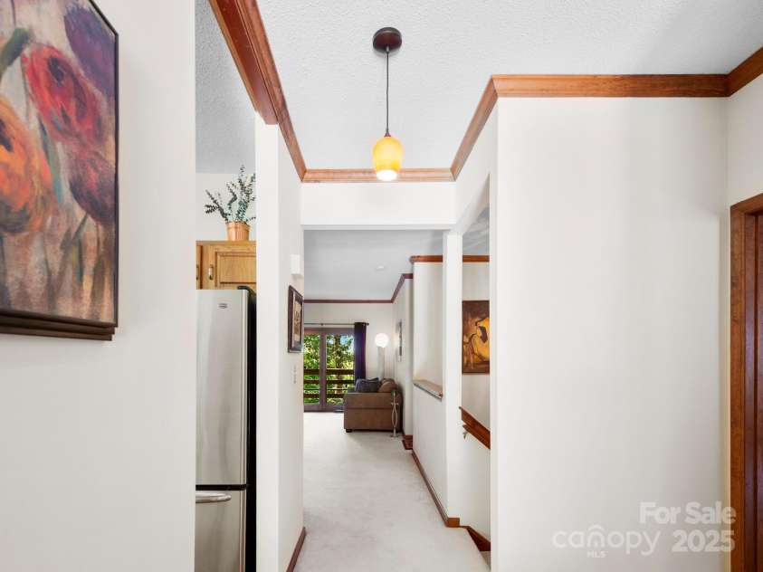 305 Piney Mountain Drive, Asheville, NC 28805.  MLS# CAR4286692, YatesRealty ID 9539. Foyer to living room 