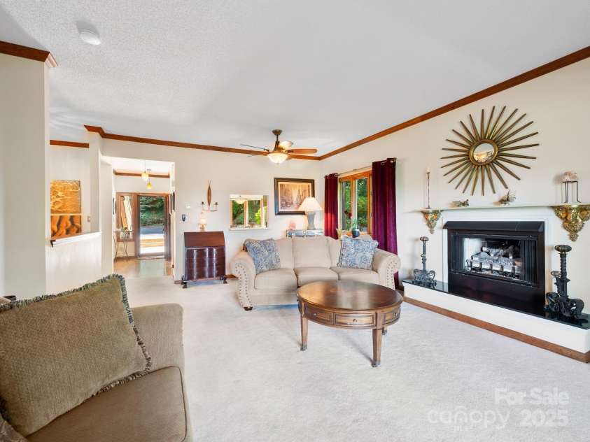 305 Piney Mountain Drive, Asheville, NC 28805.  MLS# CAR4286692, YatesRealty ID 9539. Large living room with gas fireplace