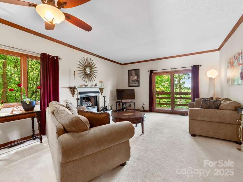 305 Piney Mountain Drive, Asheville, NC 28805.  MLS# CAR4286692, YatesRealty ID 9539. Living room with access to covered deck
