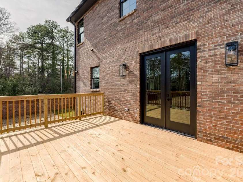 100 Brackenbury Lane, Charlotte, NC 28270.  MLS# CAR4352384, YatesRealty ID 9578. Backyard deck. 