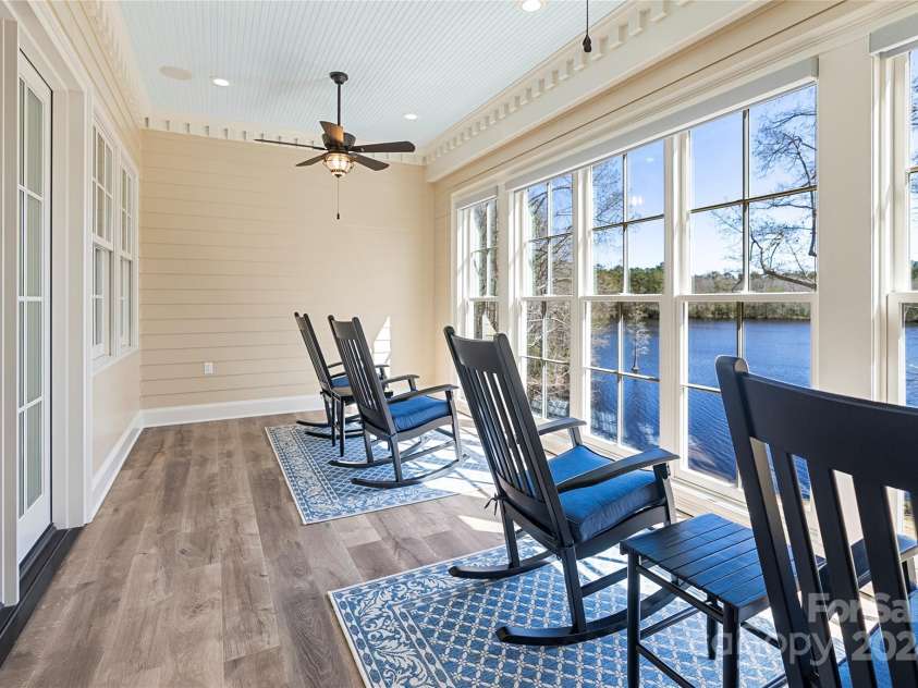 229 Joseph Kershaw Road, Eastover, SC 29044.  MLS# CAR4122309, YatesRealty ID 958. Adjoining 2nd floor sunroom is an ideal place to enjoy a cold beverage after a hard workout