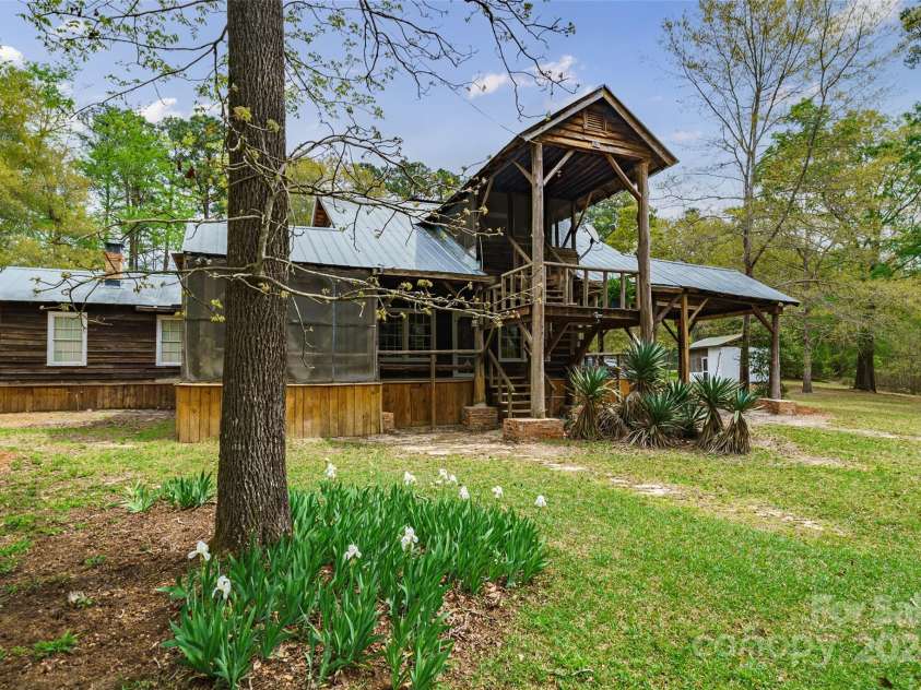 229 Joseph Kershaw Road, Eastover, SC 29044.  MLS# CAR4122309, YatesRealty ID 958. Hunting Lodge overlooks the lake and has 4 bedroom 2.5 bedroom
