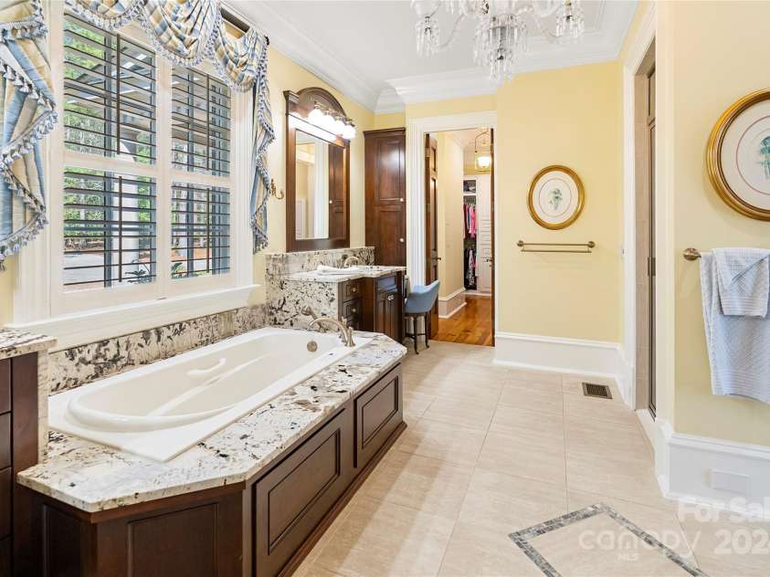 229 Joseph Kershaw Road, Eastover, SC 29044.  MLS# CAR4122309, YatesRealty ID 958. Primary bathroom w/steam shower, air jetted garden tub, 2 vanities, 2 walk-in closets, towel warmer and heated floors
