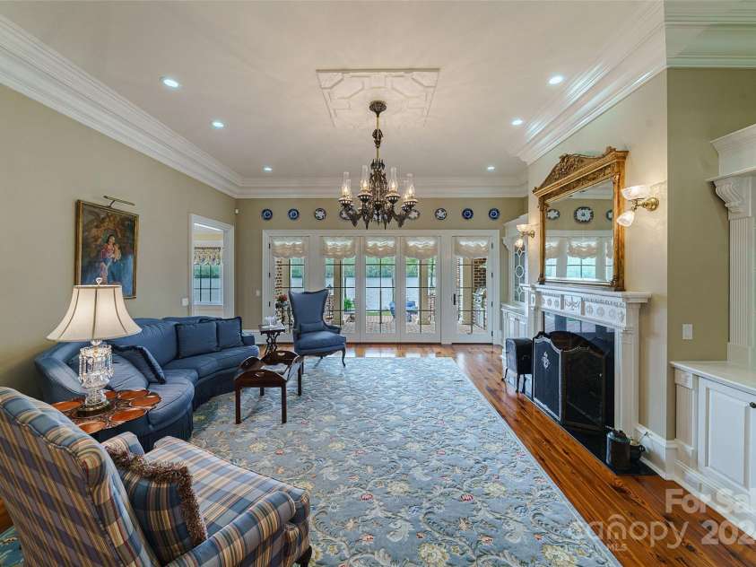 229 Joseph Kershaw Road, Eastover, SC 29044.  MLS# CAR4122309, YatesRealty ID 958. Sold Furnished, includes antiques and custom made furniture collected from around the world, great room overlooking the lake w/custom built-ins & 12' ceilings