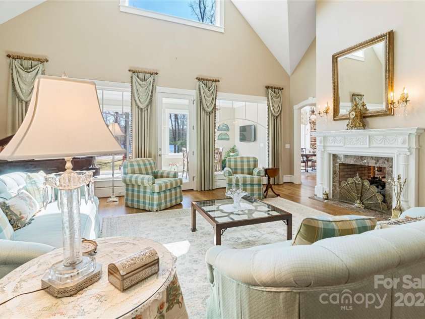 229 Joseph Kershaw Road, Eastover, SC 29044.  MLS# CAR4122309, YatesRealty ID 958. Two story great room with built-ins and walls of windows overlooking the lake