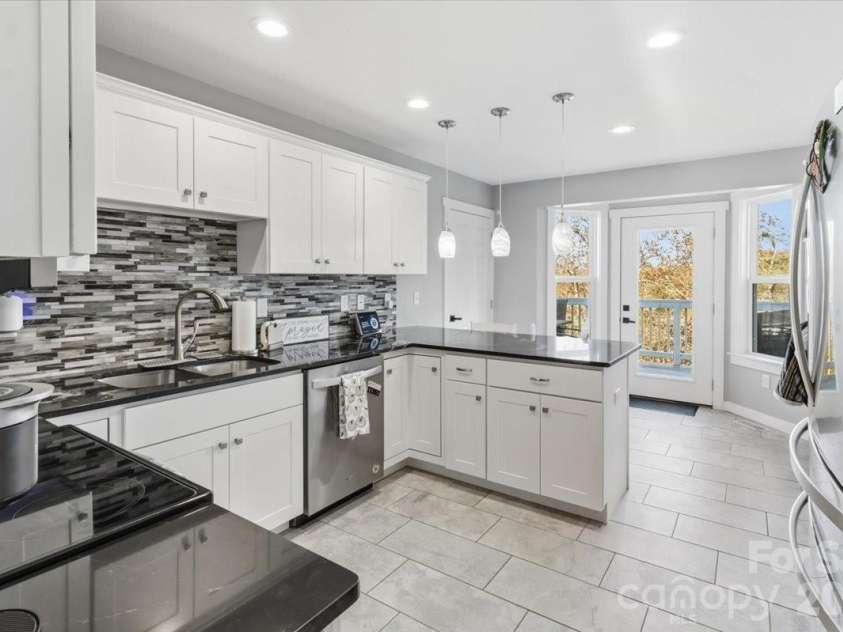 9 Old Amber Drive, Weaverville, NC 28787.  MLS# CAR4320794, YatesRealty ID 9583. Kitchen view from Dining Area