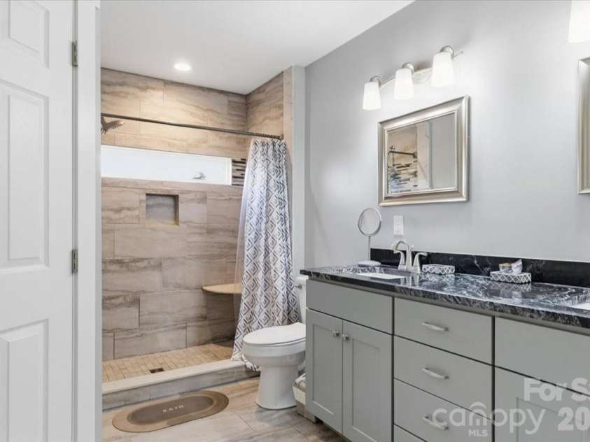 9 Old Amber Drive, Weaverville, NC 28787.  MLS# CAR4320794, YatesRealty ID 9583. Main Bathroom