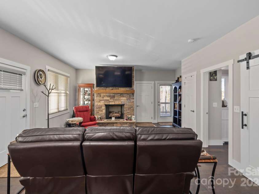 155 Hayes Ridge Lane, Mills River, NC 28759.  MLS# CAR4199843, YatesRealty ID 9590. Open floor plan living room with entry to front porch and side patio.