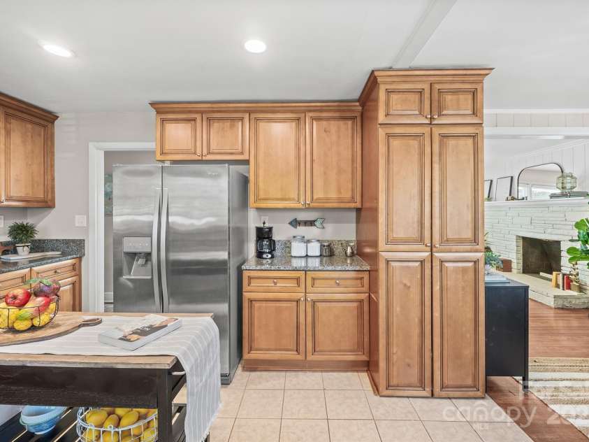 5748 Farmbrook Drive, Charlotte, NC 28210.  MLS# CAR4302947, YatesRealty ID 9592. Upgraded Kitchen offers granite counters, stainless steel appliances including Refrigerator to remain, gas range & plenty of cabinetry for storage!