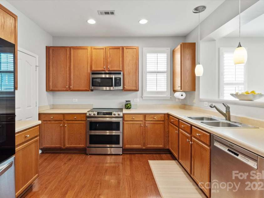 158 Council House Road, Fort Mill, SC 29708.  MLS# CAR4239888, YatesRealty ID 9596. Stainless Steele appliances and pendant lighting