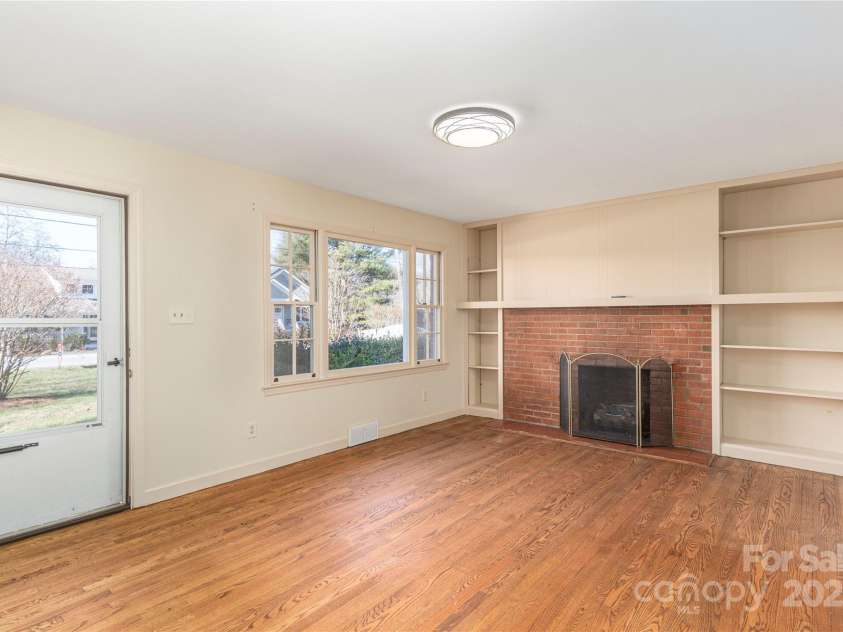 114/116 Arco Road, Asheville, NC 28805.  MLS# CAR4227410, YatesRealty ID 9606. Right side- Living with gas log fireplace