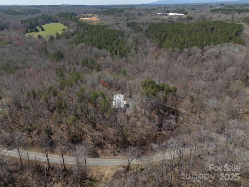 582 County Line Road, Rutherfordton, NC 28139.  MLS# CAR4235377, YatesRealty ID 9609. Aerial of house from road