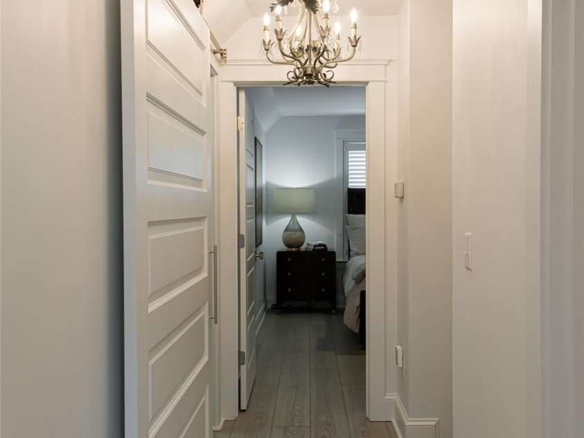 15 Dayflower Drive, Asheville, NC 28803.  MLS# CAR4209774, YatesRealty ID 9613. Main level hallway  to primary suite and half bath