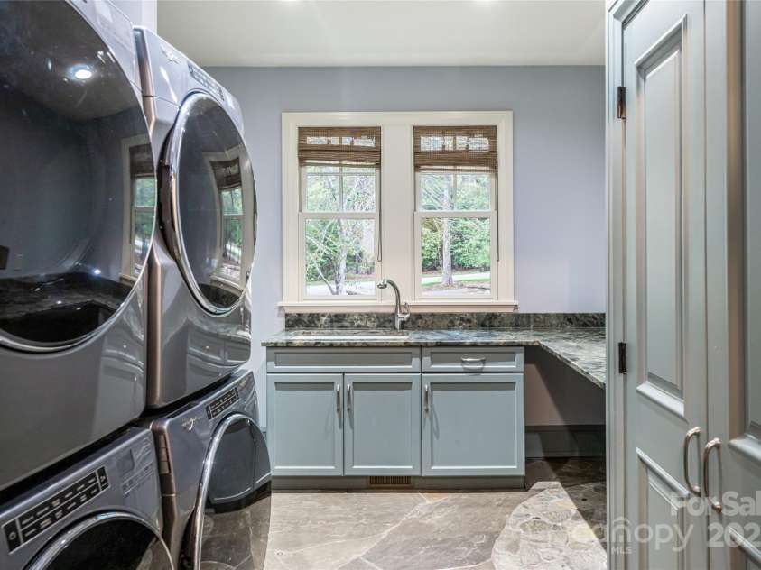 32 Ramble Way, Asheville, NC 28803.  MLS# CAR4251948, YatesRealty ID 9614. Double washer/dryer in laundry room