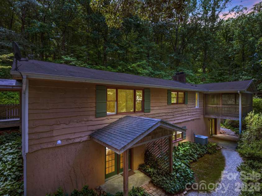 18 Wild Violet Lane, Arden, NC 28704.  MLS# CAR4284838, YatesRealty ID 9618. Front elevation at twilight