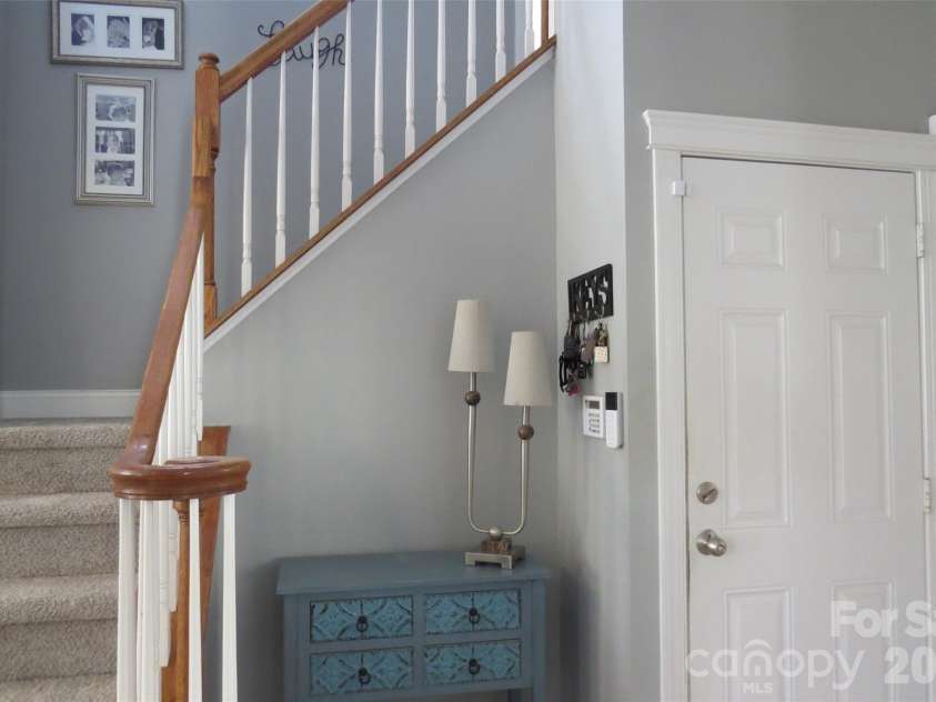 8500 Willow Branch Drive, Waxhaw, NC 28173.  MLS# CAR4360850, YatesRealty ID 9625. Coat closet, drop off area with your stairs leading upstairs