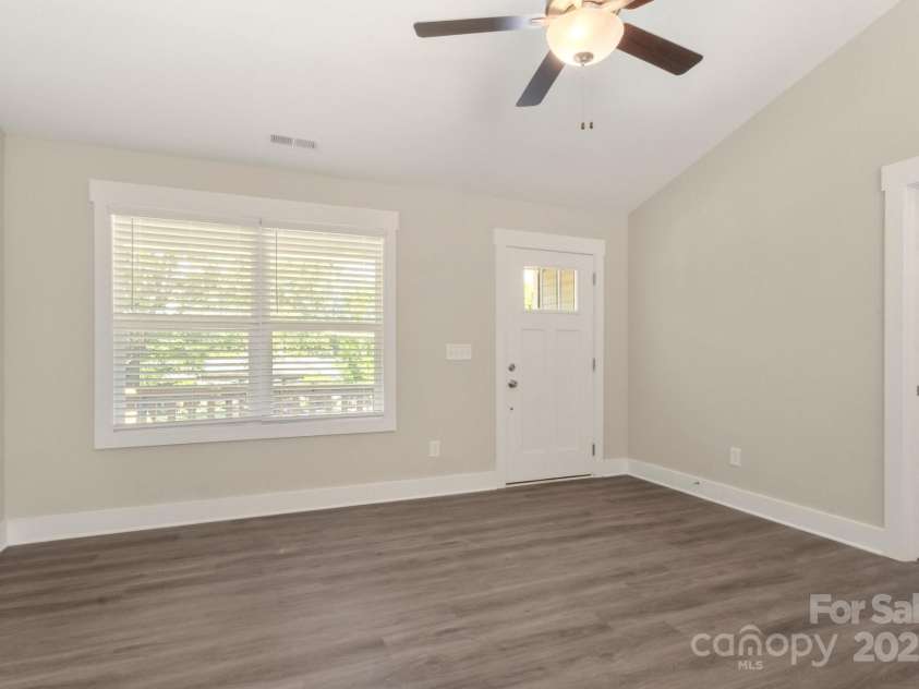 438 Forest Lake Road, Forest City, NC 28043.  MLS# CAR4252151, YatesRealty ID 9628. Living Room w/ fan