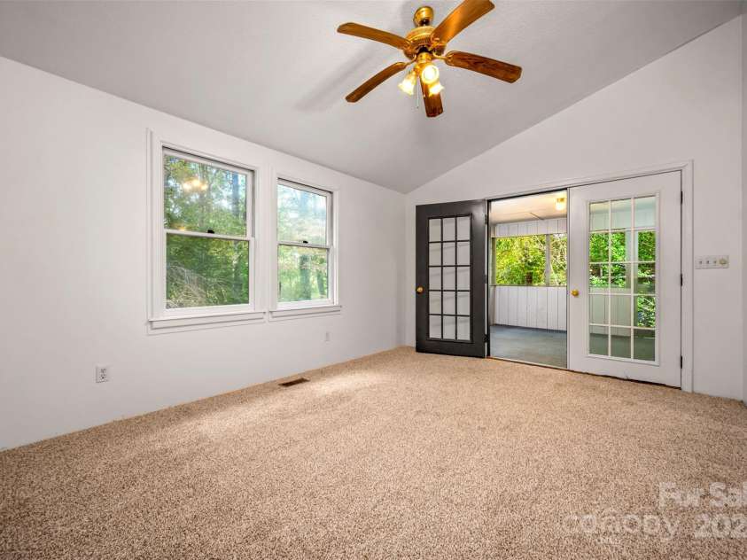 102 Windwood Hill Road, Hendersonville, NC 28739.  MLS# CAR4305919, YatesRealty ID 963. French doors leading to screen porch