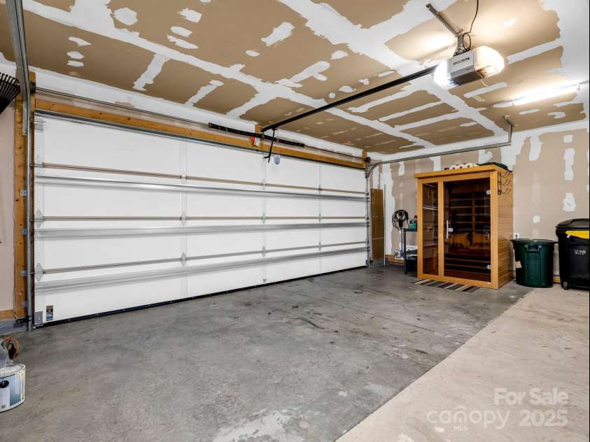 178 Flynn Court, Lake Lure, NC 28746.  MLS# CAR4204913, YatesRealty ID 9645. 2-car oversized garage complete with a 2-person sauna and level 2 EV charger.