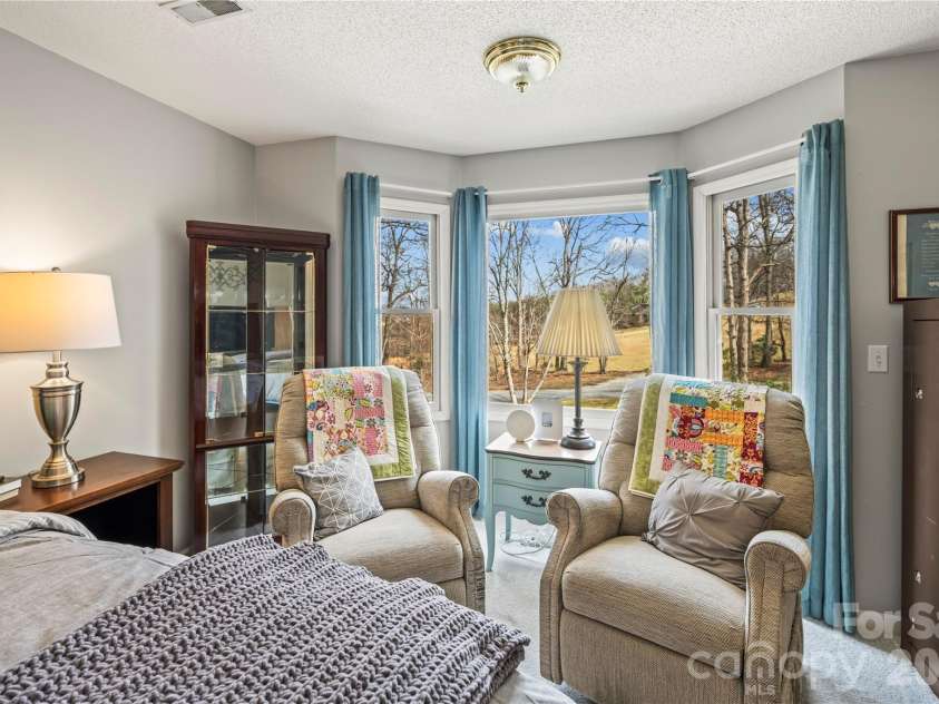 112 Bridlewood Trail, Mills River, NC 28759.  MLS# CAR4351397, YatesRealty ID 9659. Reading nook with large windows in main bedroom. 