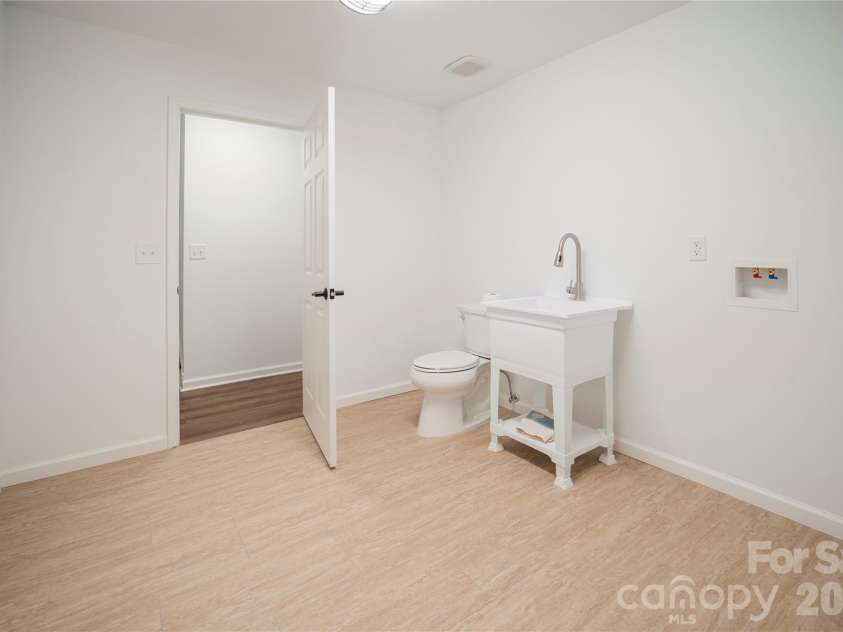 106 Shelly Drive, Hendersonville, NC 28792.  MLS# CAR4366479, YatesRealty ID 9675. Laundry tub and commode