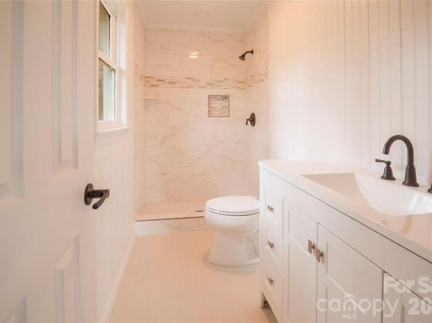 106 Shelly Drive, Hendersonville, NC 28792.  MLS# CAR4366479, YatesRealty ID 9675. Primary bath, tiled shower