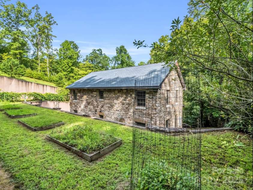 2452 Lake Adger Parkway, Mill Spring, NC 28756.  MLS# CAR4222407, YatesRealty ID 968. Rear from upper garden