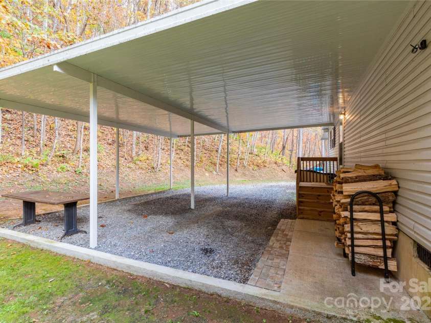 418 Milk Sick Cove, Cullowhee, NC 28723.  MLS# CAR4193351, YatesRealty ID 9695. Carport