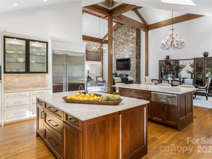 268 Holly Arbor Lane, Asheville, NC 28803.  MLS# CAR4268471, YatesRealty ID 97. Dual islands with quartzite countertops. One island is dedicated to culinary preparation, while the other offers buffet-style seating.