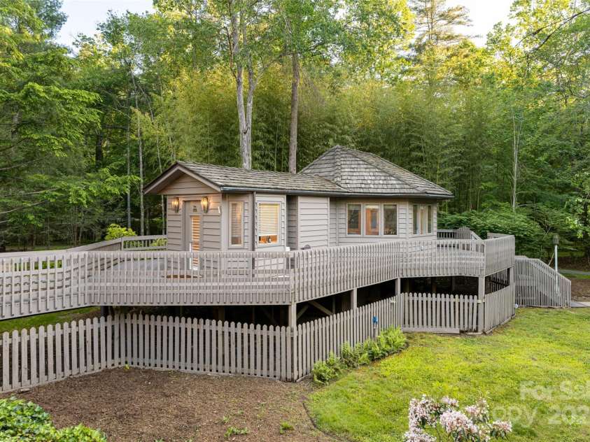 268 Holly Arbor Lane, Asheville, NC 28803.  MLS# CAR4268471, YatesRealty ID 97. The second guest cottage is an octagonal studio garden retreat located near the main residence.  It Whether envisioned as a guest suite, private office, fitness studio, or tranquil massage room, this unique structure del