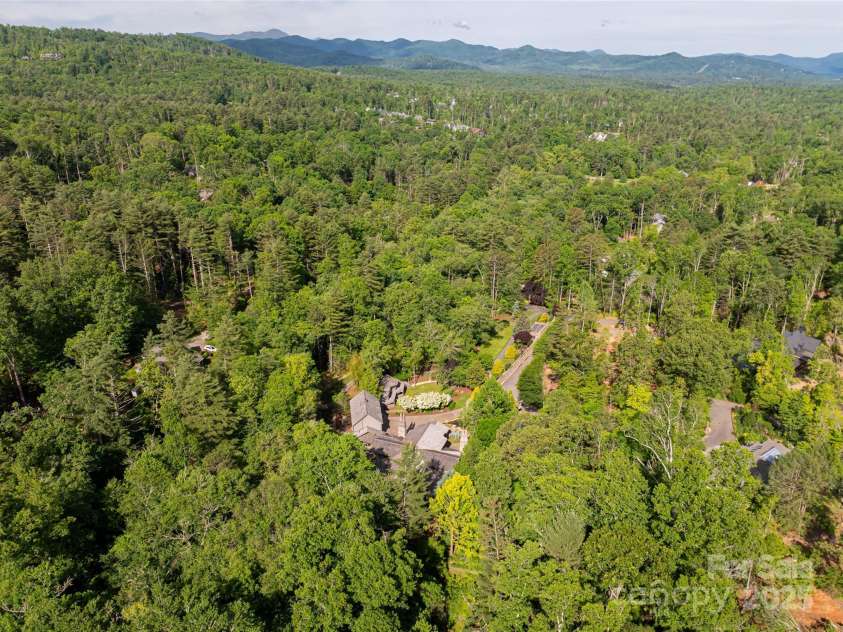 268 Holly Arbor Lane, Asheville, NC 28803.  MLS# CAR4268471, YatesRealty ID 97. This 4-acre estate is situated within the prestigious gates of The Ramble at Biltmore Forest, this exceptional estate offers a rare opportunity: the privacy and security of a gated community without the typical architect