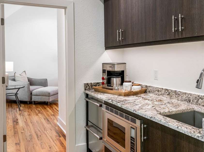 268 Holly Arbor Lane, Asheville, NC 28803.  MLS# CAR4268471, YatesRealty ID 97. Two of the five private guest suites are above the three-car garage, each thoughtfully appointed with en-suite baths and complete with a shared kitchenette