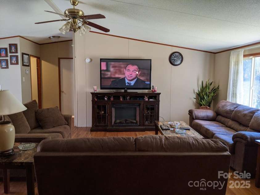 196 Mckinney Road, Weaverville, NC 28787.  MLS# CAR4326472, YatesRealty ID 970. Living room with large window and natural light