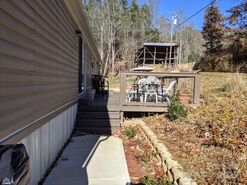 196 Mckinney Road, Weaverville, NC 28787.  MLS# CAR4326472, YatesRealty ID 970. Walkway to back deck from driveway
