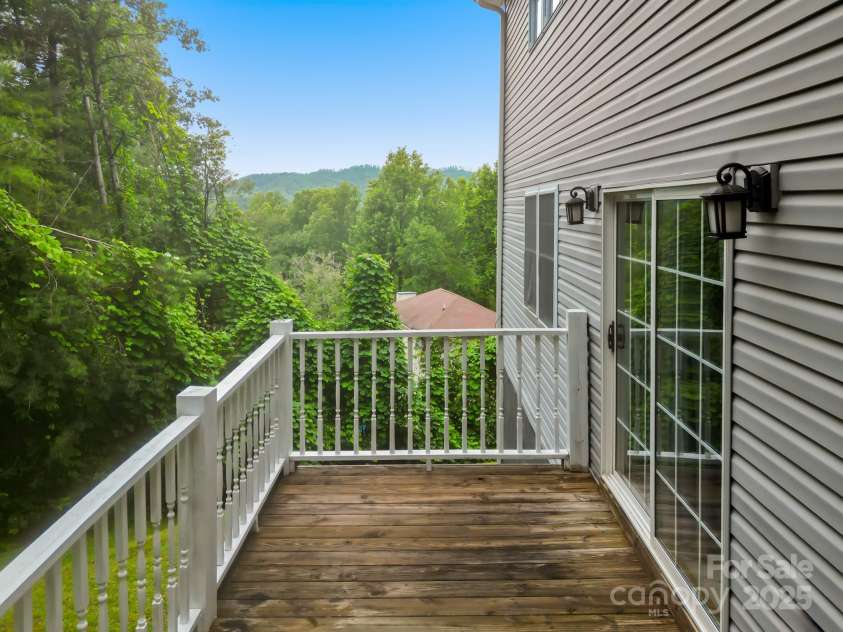 60 Hilltop View Drive, Fletcher, NC 28732.  MLS# CAR4202444, YatesRealty ID 9701. Side deck with view