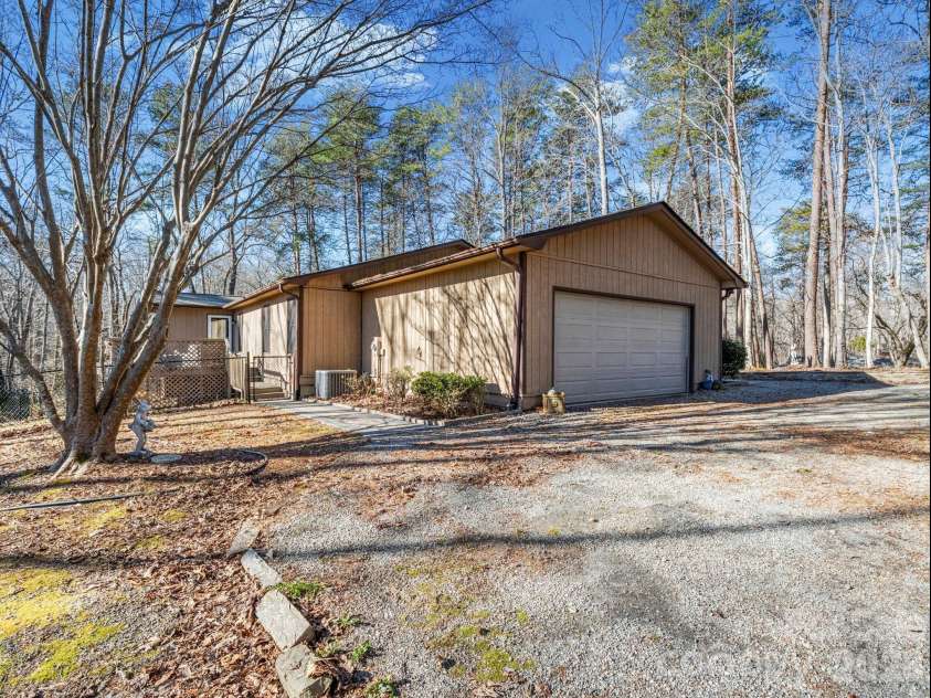 423 Mountain View Drive, Columbus, NC 28722.  MLS# CAR4345860, YatesRealty ID 9703. Side with garage