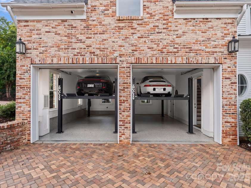 16921 Jetton Road, Cornelius, NC 28031.  MLS# CAR4191237, YatesRealty ID 971. One of two garages with lifts. Indoor parking for 7 cars.