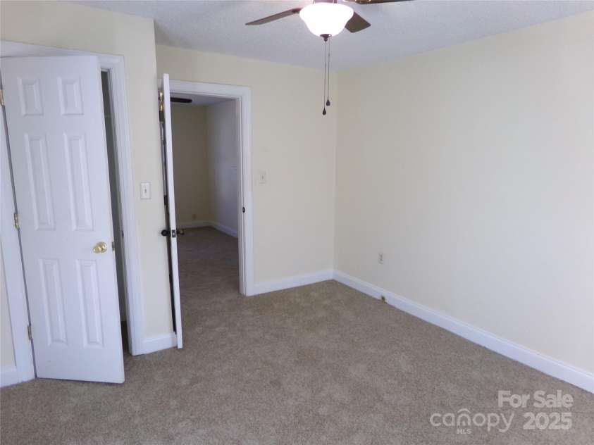 923 Efird Street, Albemarle, NC 28001.  MLS# CAR4325322, YatesRealty ID 9711. Front Bedroom 