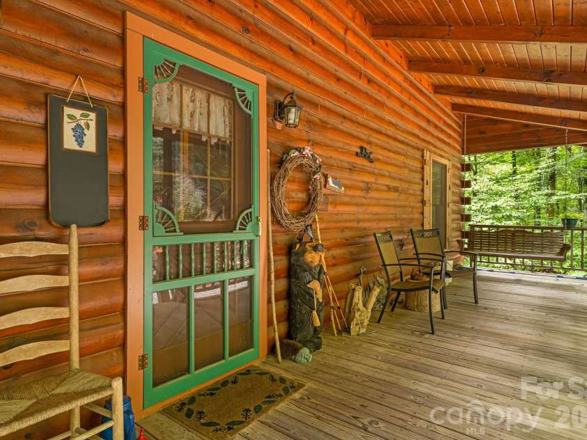 215 Goldenleaf Road, Mars Hill, NC 28754.  MLS# CAR4356364, YatesRealty ID 9718. Rocking Chair Covered Porch