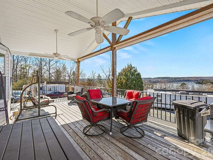103 Oriole Road, New London, NC 28127.  MLS# CAR4335932, YatesRealty ID 972. Enjoy Sunsets Over Badin Lake from your porch